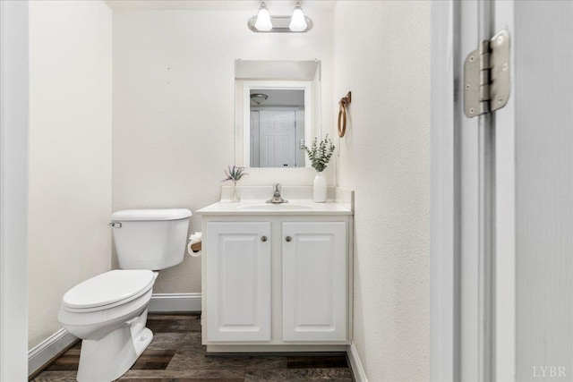 3600 Old Forest Rd Unit 107, Lynchburg, VA 24501 - half bathroom featuring vanity, wood finished floors, and a textured wall