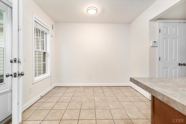 3600 Old Forest Rd Unit 107, Lynchburg, VA 24501 - unfurnished dining area with baseboards and light tile patterned floors