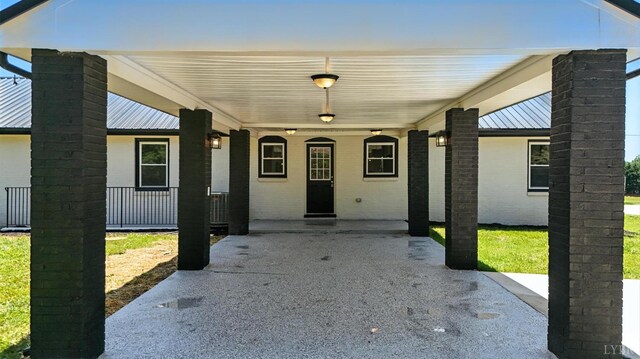 39 Lynview Dr, Lynchburg, VA 24502 - view of front of property featuring a metal roof, a chimney, a porch, and an attached carport