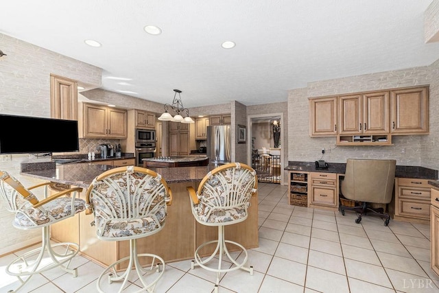 112 Haines Point Ter, Forest, VA 24551 - kitchen with stainless steel appliances, light tile patterned floors, a kitchen island, a breakfast bar, and tasteful backsplash