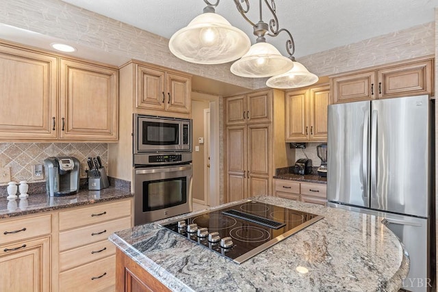 112 Haines Point Ter, Forest, VA 24551 - kitchen featuring appliances with stainless steel finishes, dark stone countertops, a kitchen island, tasteful backsplash, and a textured ceiling