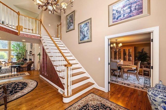 112 Haines Point Ter, Forest, VA 24551 - staircase featuring a chandelier, wood finished floors, and a high ceiling