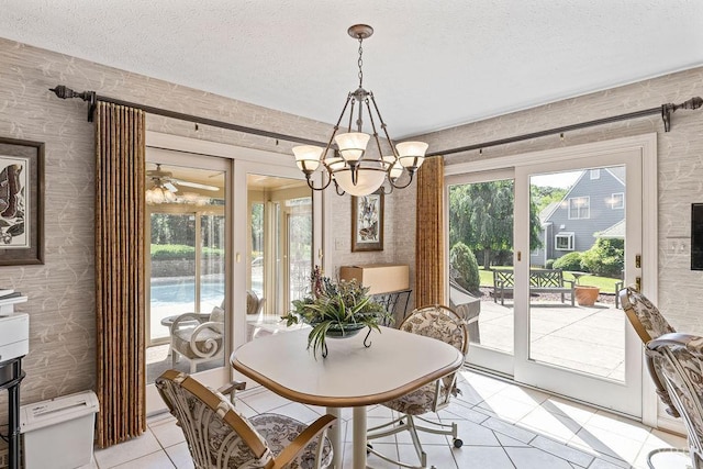 112 Haines Point Ter, Forest, VA 24551 - dining room with light tile patterned floors, wallpapered walls, a textured ceiling, and a chandelier