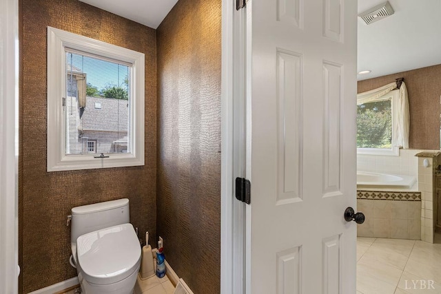 112 Haines Point Ter, Forest, VA 24551 - bathroom with plenty of natural light, tile patterned flooring, and tiled bath