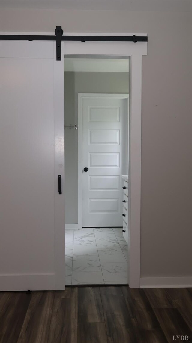 863 Winfall Rd, Gladys, VA 24554 - hallway featuring a barn door and marble look tiles