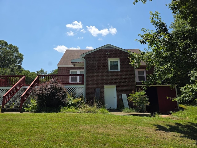 2224 Wildway Rd, Appomattox, VA 24522 - rear view of property with brick siding, a deck, a lawn, and stairs
