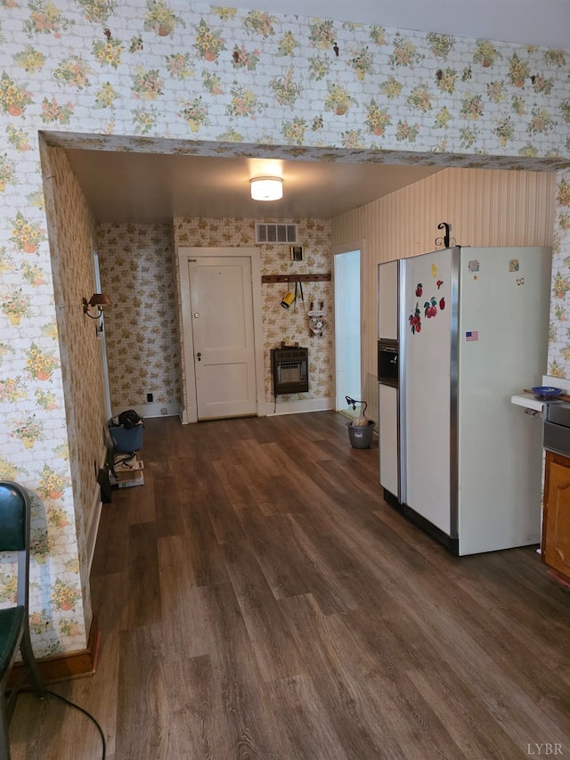 2224 Wildway Rd, Appomattox, VA 24522 - kitchen featuring wallpapered walls, white fridge with ice dispenser, dark wood-style flooring, and a large fireplace