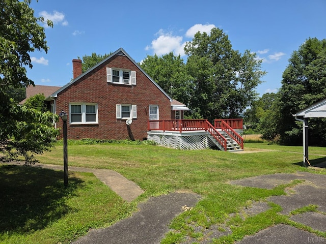 2224 Wildway Rd, Appomattox, VA 24522 - view of side of property with a deck, a chimney, a yard, and brick siding