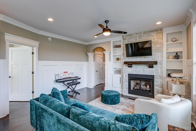 1659 Helmsdale Dr, Forest, VA 24551 - living room featuring a ceiling fan, dark wood finished floors, built in shelves, crown molding, and decorative columns
