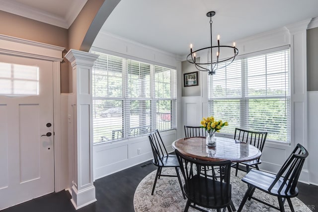 1659 Helmsdale Dr, Forest, VA 24551 - dining space featuring a decorative wall, dark wood-style flooring, crown molding, a wainscoted wall, and arched walkways