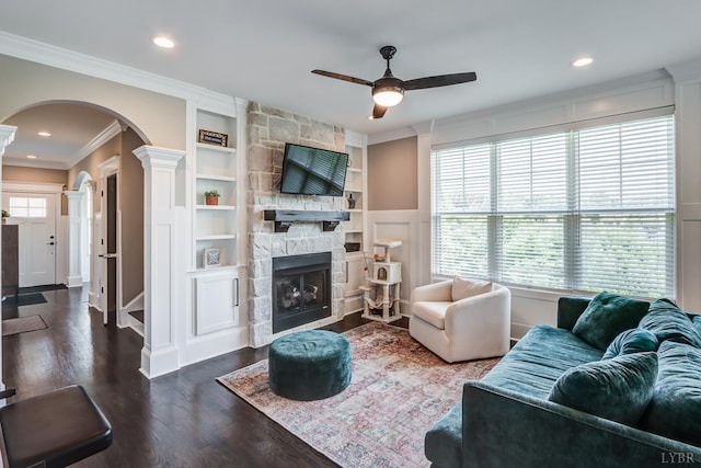 1659 Helmsdale Dr, Forest, VA 24551 - living area with arched walkways, a ceiling fan, decorative columns, crown molding, and built in shelves
