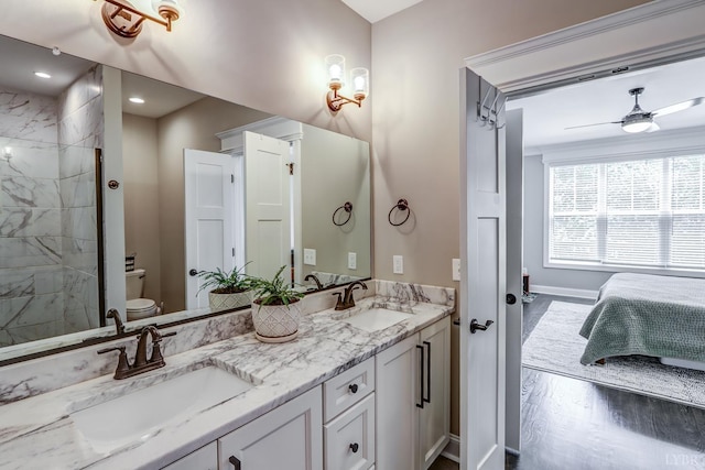1659 Helmsdale Dr, Forest, VA 24551 - bathroom with double vanity, connected bathroom, wood finished floors, a tile shower, and ceiling fan