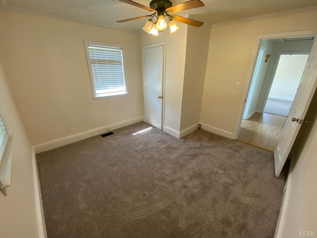 115 Primrose Ln, Lynchburg, VA 24501 - unfurnished bedroom with attic access, carpet, ornamental molding, and a ceiling fan