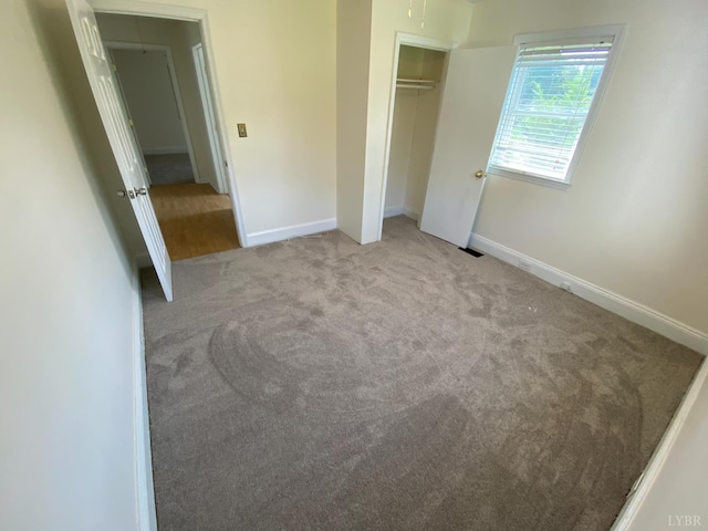 115 Primrose Ln, Lynchburg, VA 24501 - unfurnished bedroom featuring carpet flooring, a closet, and attic access