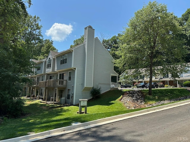 6 Jefferson Village Dr, Forest, VA 24551 - view of side of property featuring a chimney and a lawn