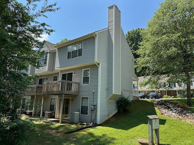 6 Jefferson Village Dr, Forest, VA 24551 - rear view of house featuring a lawn, a chimney, and a wooden deck