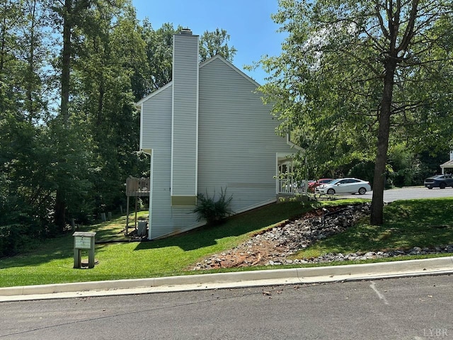 6 Jefferson Village Dr, Forest, VA 24551 - view of home's exterior featuring a lawn and a chimney