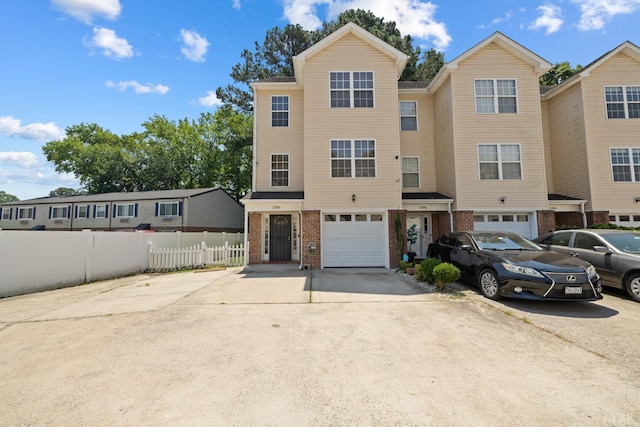 2398 Azalea Garden Rd, Norfolk, VA 23513 - view of property featuring concrete driveway, brick siding, and an attached garage