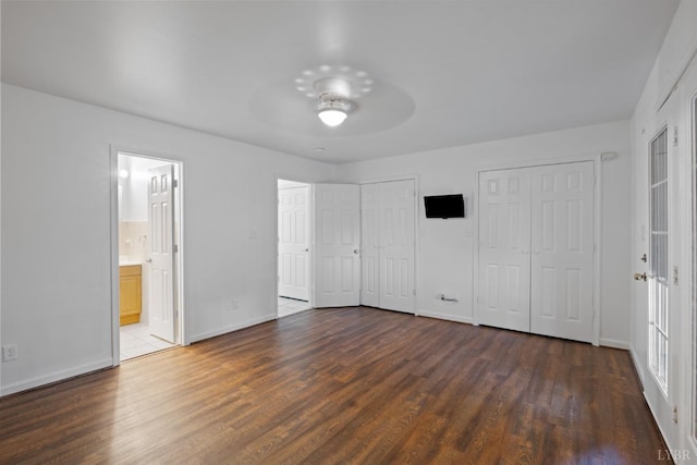 2398 Azalea Garden Rd, Norfolk, VA 23513 - unfurnished bedroom featuring multiple closets, wood finished floors, ensuite bath, and ceiling fan