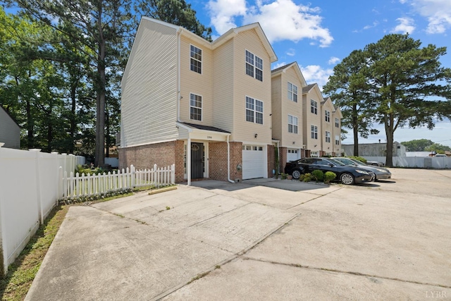 2398 Azalea Garden Rd, Norfolk, VA 23513 - view of building exterior with concrete driveway and a garage