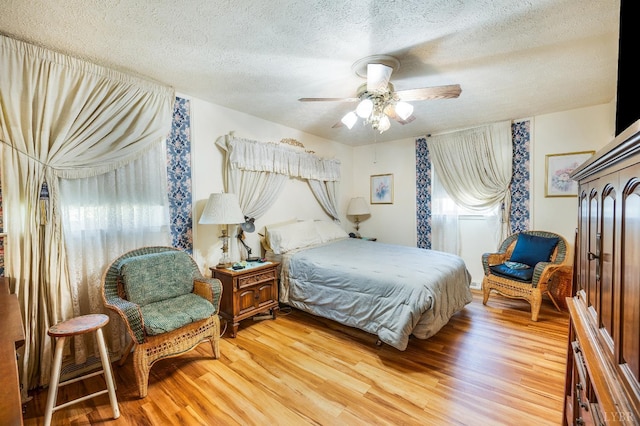 723 Custer Dr, Lynchburg, VA 24502 - bedroom with light wood-style floors, a textured ceiling, and ceiling fan