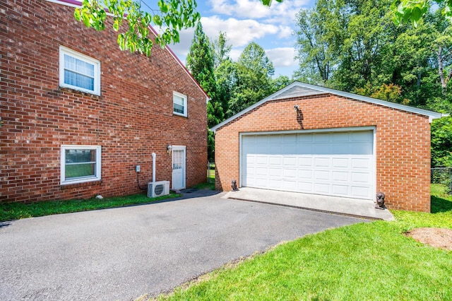 723 Custer Dr, Lynchburg, VA 24502 - view of property exterior featuring an outdoor structure, a garage, brick siding, and a lawn