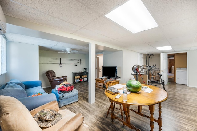 723 Custer Dr, Lynchburg, VA 24502 - living area with a drop ceiling, wood finished floors, washer / clothes dryer, and a wall unit AC