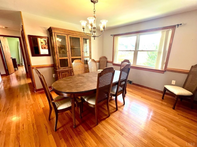 149 Powtan Dr, Lynchburg, VA 24502 - dining area with a chandelier and light wood finished floors