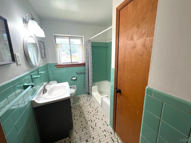 149 Powtan Dr, Lynchburg, VA 24502 - bathroom featuring tile walls, tile patterned flooring, a wainscoted wall, vanity, and shower / tub combo with curtain