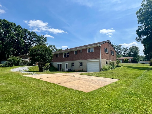 149 Powtan Dr, Lynchburg, VA 24502 - rear view of property with an attached garage, a lawn, and driveway