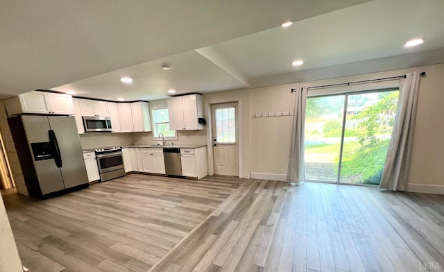149 Powtan Dr, Lynchburg, VA 24502 - kitchen with stainless steel appliances, light wood-style floors, white cabinets, recessed lighting, and light countertops