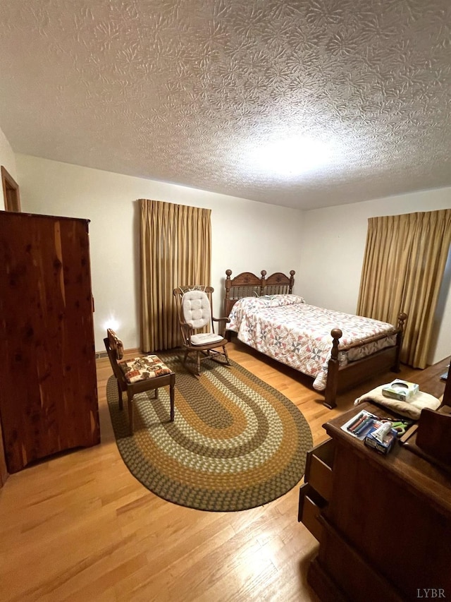 1102 Smith St, Bedford, VA 24523 - bedroom with wood finished floors and a textured ceiling