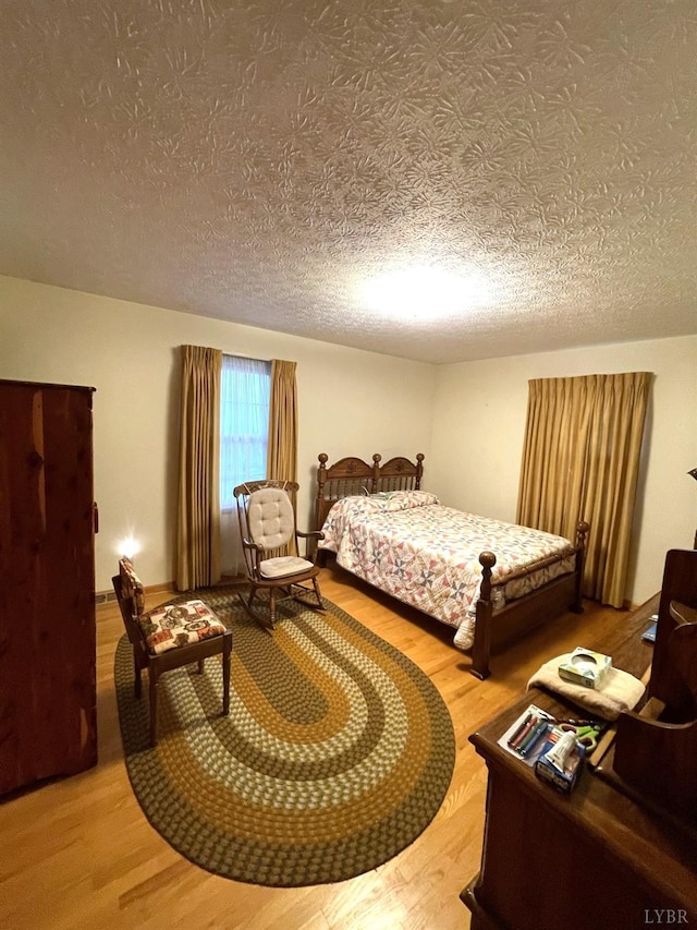 1102 Smith St, Bedford, VA 24523 - bedroom with wood finished floors and a textured ceiling