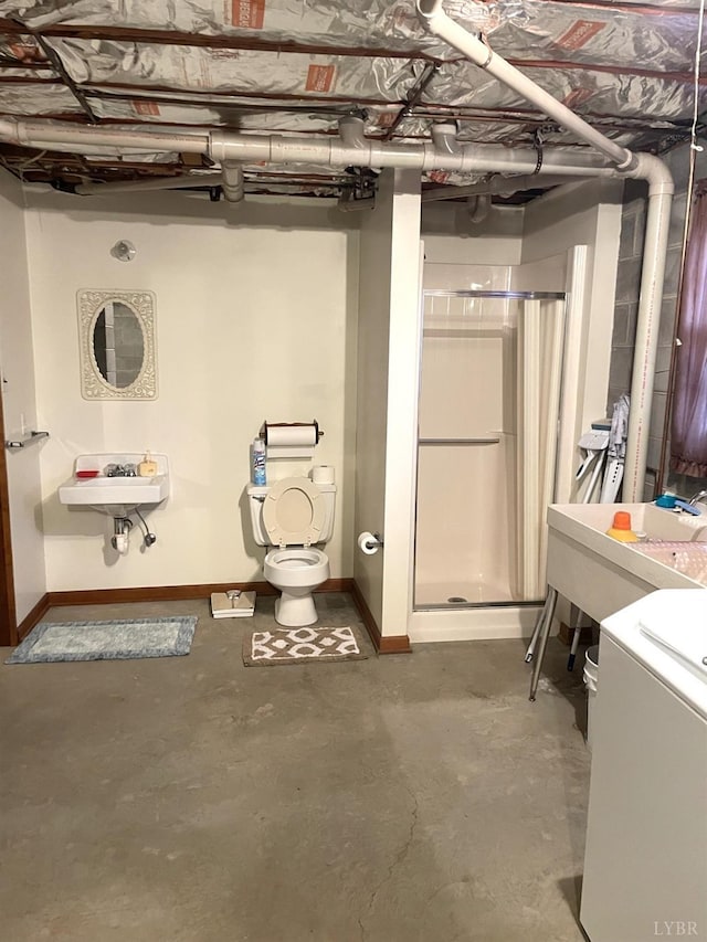 1102 Smith St, Bedford, VA 24523 - unfinished below grade area featuring baseboards and washer / clothes dryer
