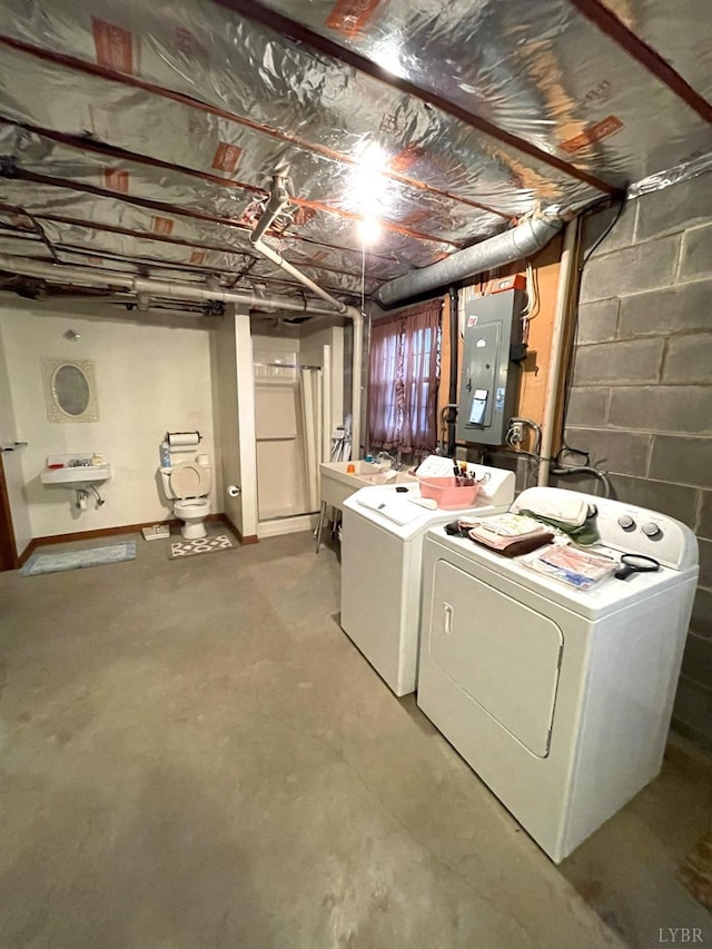 1102 Smith St, Bedford, VA 24523 - unfinished basement featuring washer and clothes dryer, electric panel, and concrete block wall