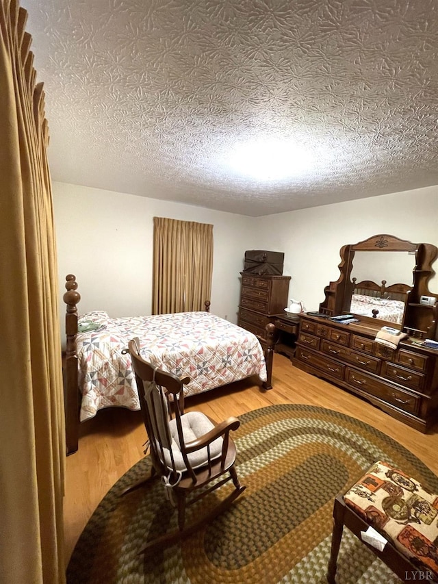 1102 Smith St, Bedford, VA 24523 - bedroom featuring light wood-type flooring and a textured ceiling