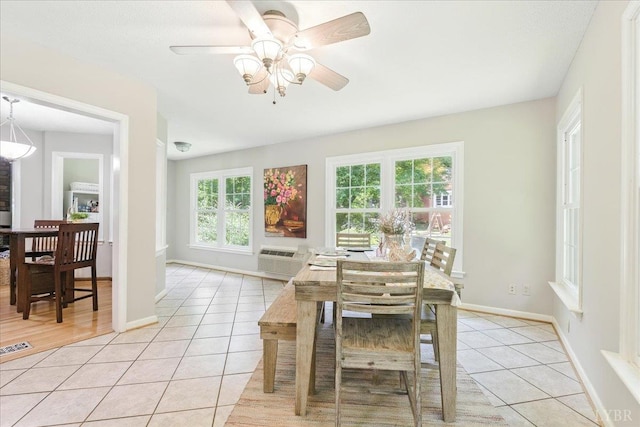 702 Kings Rd, Lynchburg, VA 24502 - dining room with light tile patterned flooring, ceiling fan, and an AC wall unit