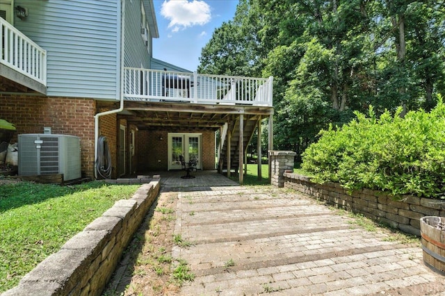702 Kings Rd, Lynchburg, VA 24502 - deck with french doors, a patio, stairway, and a yard