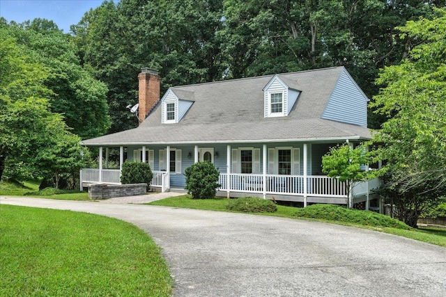 702 Kings Rd, Lynchburg, VA 24502 - view of front of home with covered porch, a chimney, a front yard, and driveway