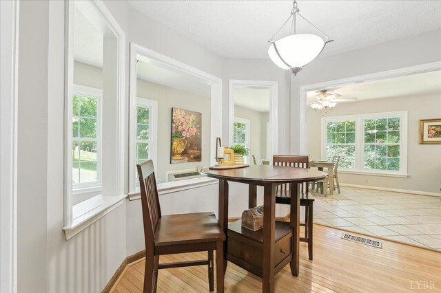 702 Kings Rd, Lynchburg, VA 24502 - dining space featuring baseboards and light wood-type flooring