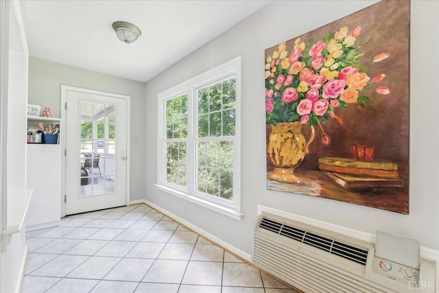 702 Kings Rd, Lynchburg, VA 24502 - doorway to outside featuring light tile patterned floors and a wall unit AC