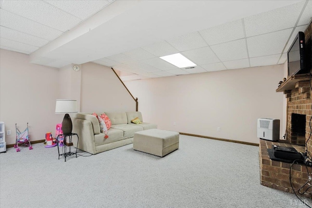 702 Kings Rd, Lynchburg, VA 24502 - living room featuring carpet floors, a paneled ceiling, and a brick fireplace