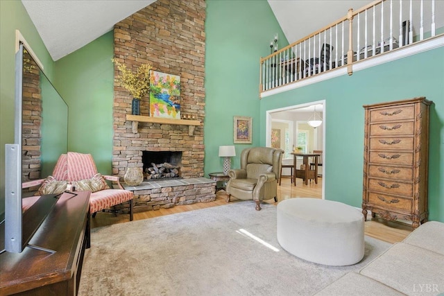 702 Kings Rd, Lynchburg, VA 24502 - living room featuring high vaulted ceiling, wood finished floors, and a fireplace