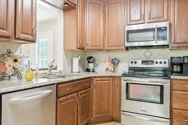 702 Kings Rd, Lynchburg, VA 24502 - kitchen featuring appliances with stainless steel finishes, light stone countertops, and tasteful backsplash