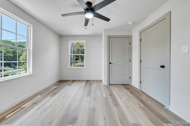 614 7th St, Lynchburg, VA 24504 - unfurnished bedroom featuring light wood-type flooring and a ceiling fan