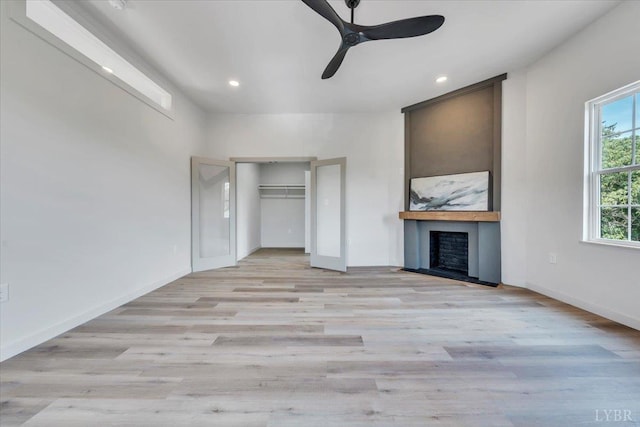 614 7th St, Lynchburg, VA 24504 - unfurnished bedroom with light wood-style floors, a fireplace, recessed lighting, and ceiling fan