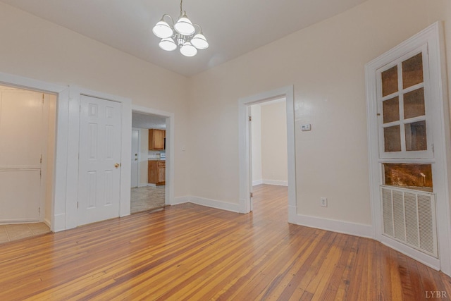3150 Campbell Ave, Lynchburg, VA 24501 - spare room featuring light wood finished floors and a chandelier