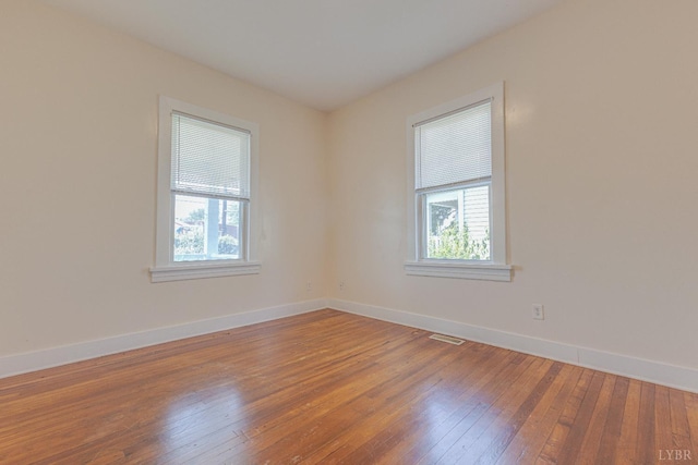 3150 Campbell Ave, Lynchburg, VA 24501 - spare room featuring healthy amount of natural light and hardwood / wood-style flooring