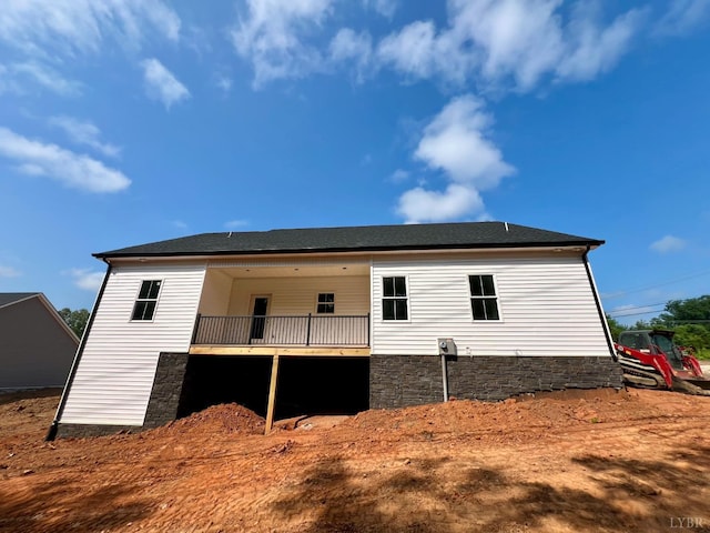 0 Graham Creek Rd, Madison Heights, VA 24572 - back of property featuring a wooden deck, stone siding, and a shingled roof