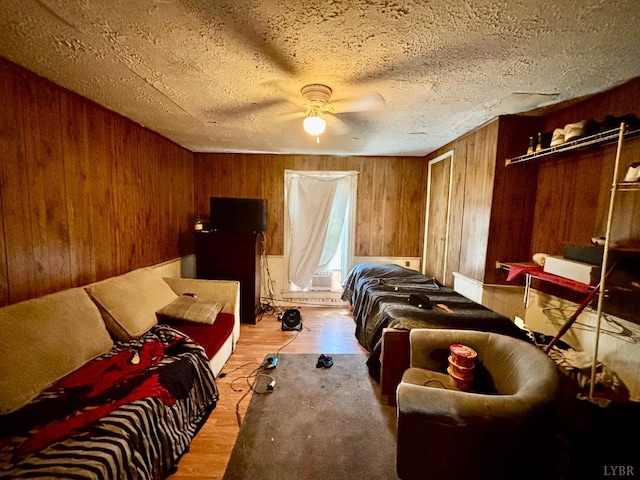 1329 Campbell Ave, Lynchburg, VA 24501 - bedroom featuring wood walls, wood finished floors, ceiling fan, and a textured ceiling